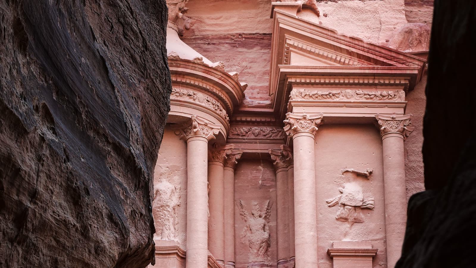 The Treasury at Petra framed by canyon walls