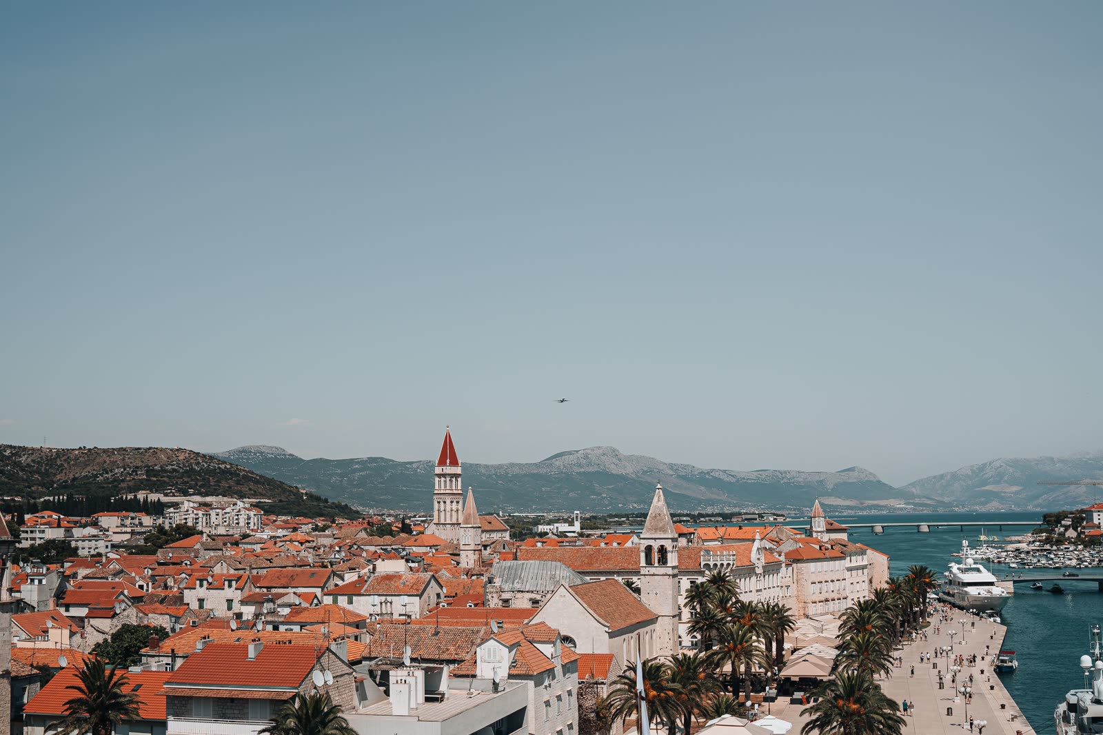 A Dalmatian harbour town of stone houses and moored boats.